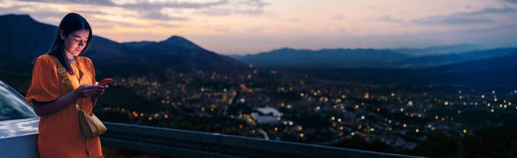 Woman in front of a city skyline