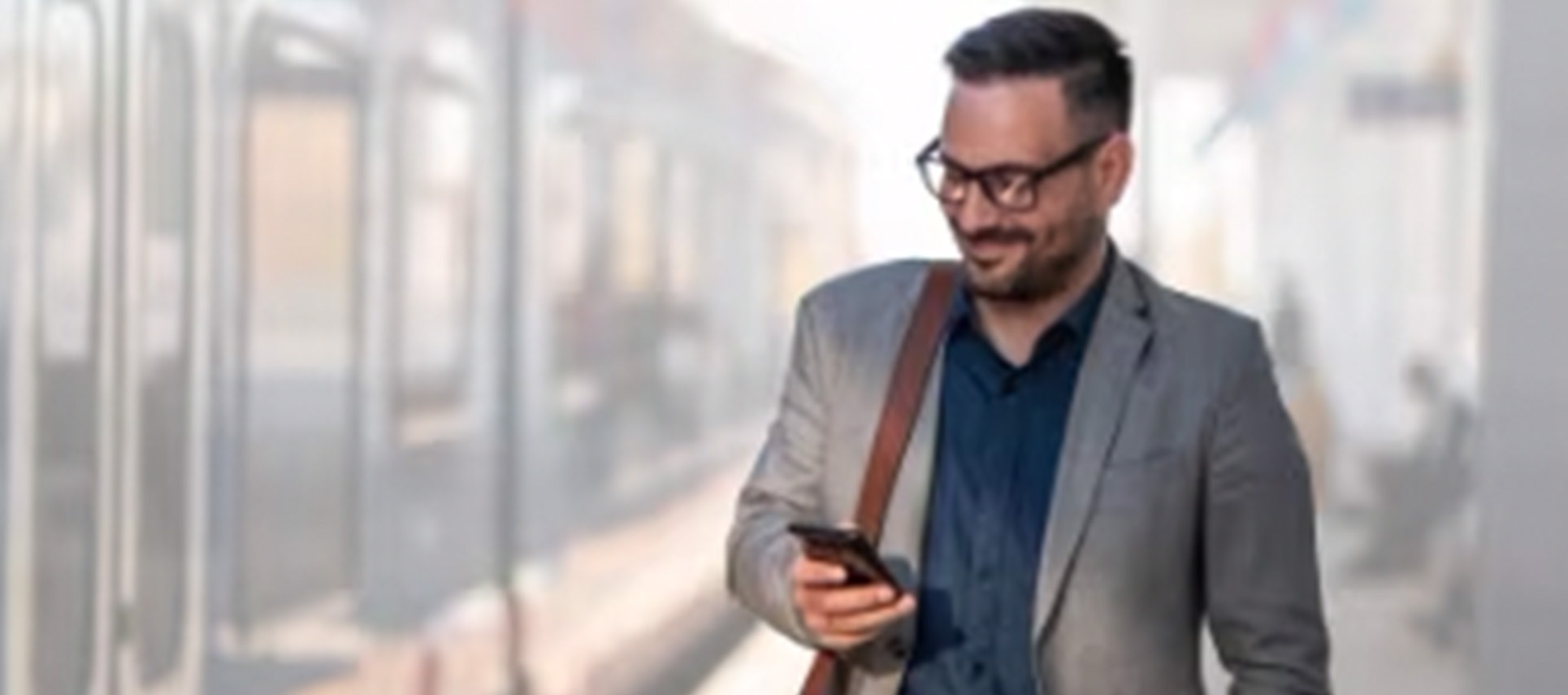 Businessman in suit using smartphone