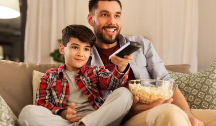 Father and son watching Spectrum TV.