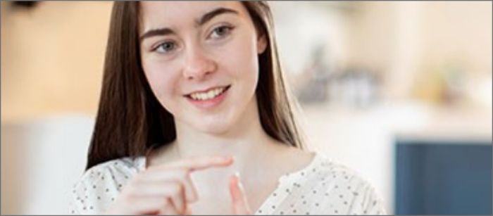 Deaf Spectrum customer using sign language. 