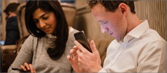 Man and woman using Spectrum's vision accessibility tools.