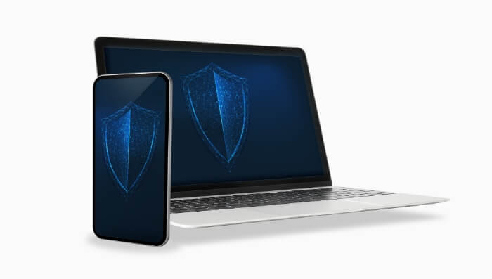 Laptop and mobile phone with shields on their screens to depict Spectrum's Advanced WiFi security