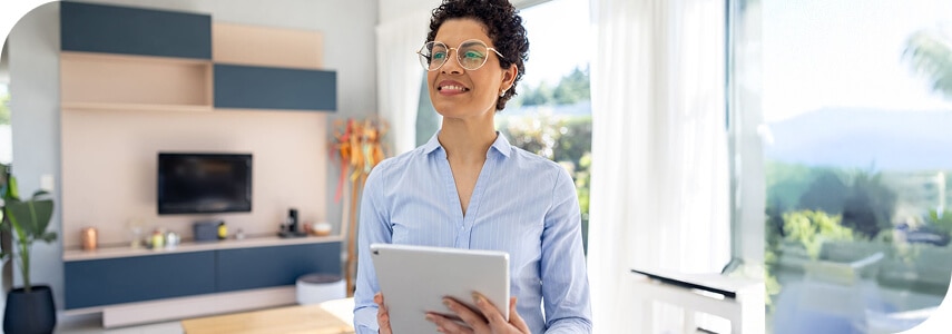 A woman looking at Spectrum's property owner benefits on her tablet