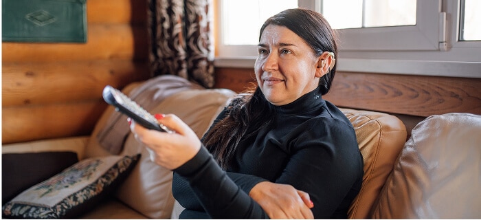 Woman using hearing solutions from Spectrum