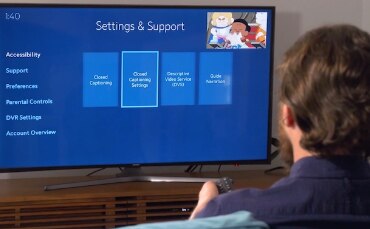 Man selects accessibility options in Spectrum TV menu
