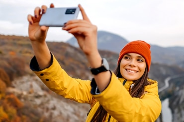 Woman outdoors with mobile device