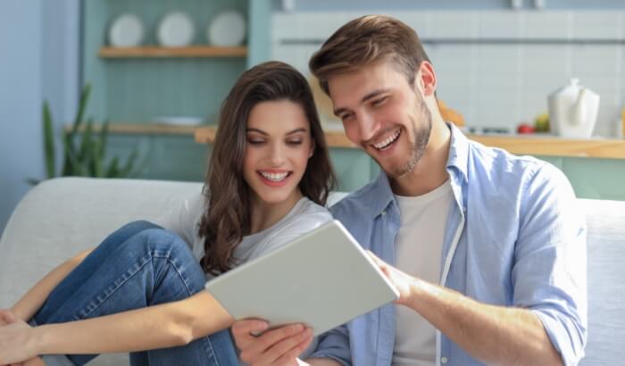 Couple interacting with tablet