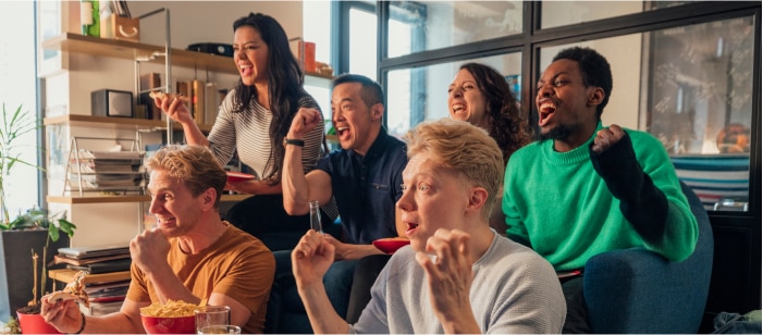 A group of people streaming live sports On Demand with Spectrum