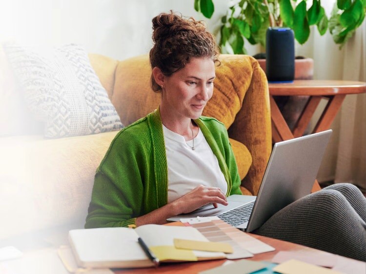 Woman enjoying Spectrum Internet on the couch