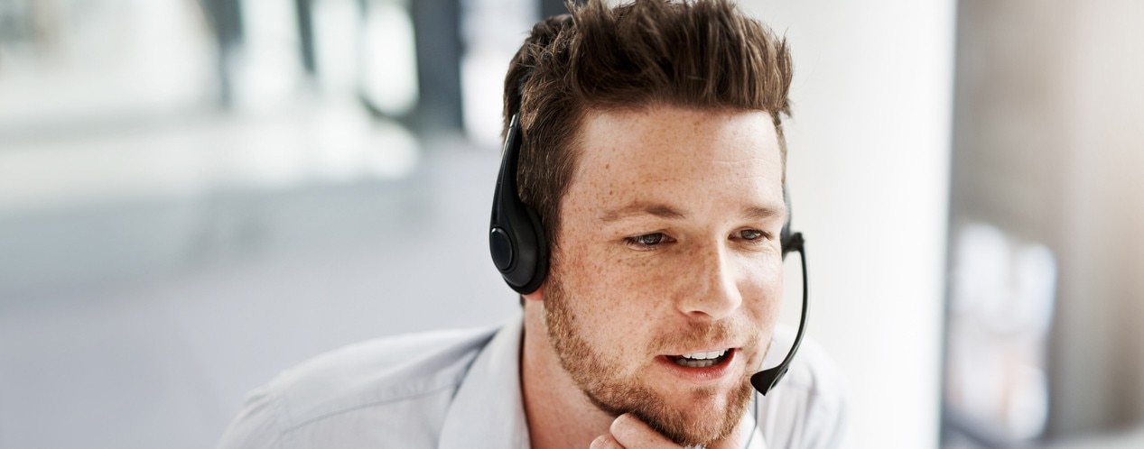 Shot of a handsome young man working in a call center