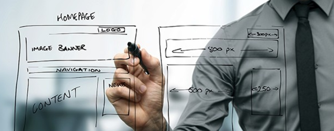 Businessman drawing a wireframe.