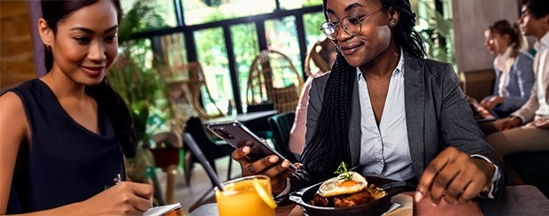 Businesswoman having lunch in restaurant