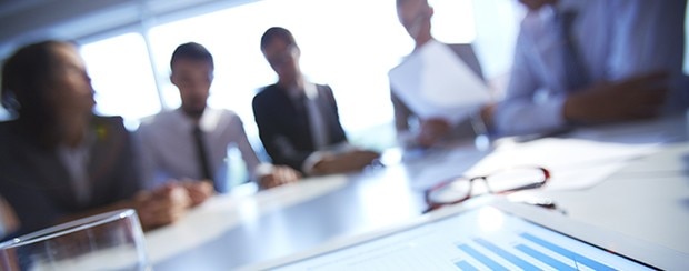 Businesspeople at a conference table.
