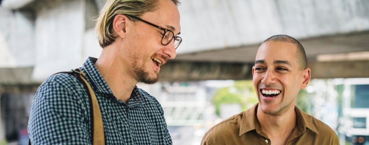 Two coworkers share a laugh