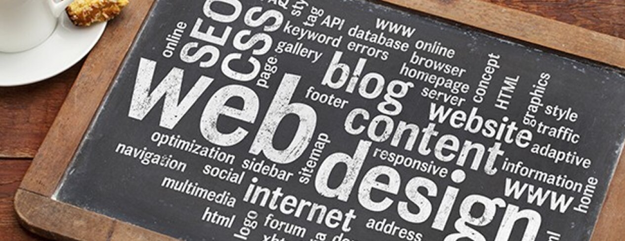 Word cloud of web design terms on a chalk board.