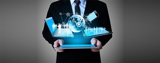 Man holding a tablet with image of connected devices above it.