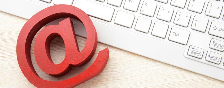 3D @ symbol rests on computer keyboard