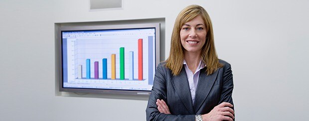 Business woman presenting a slide with a graph