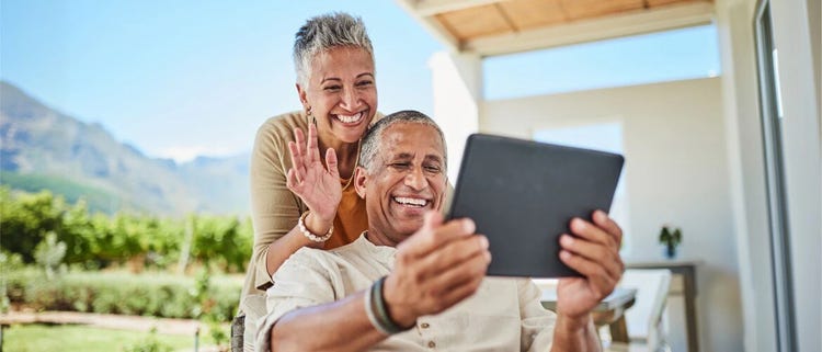 A father and son looking at laptop