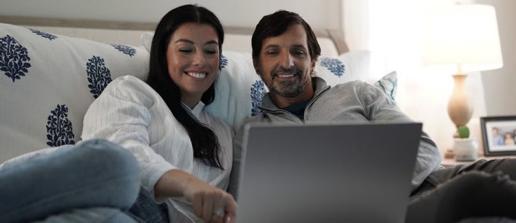 Family watching TV at home