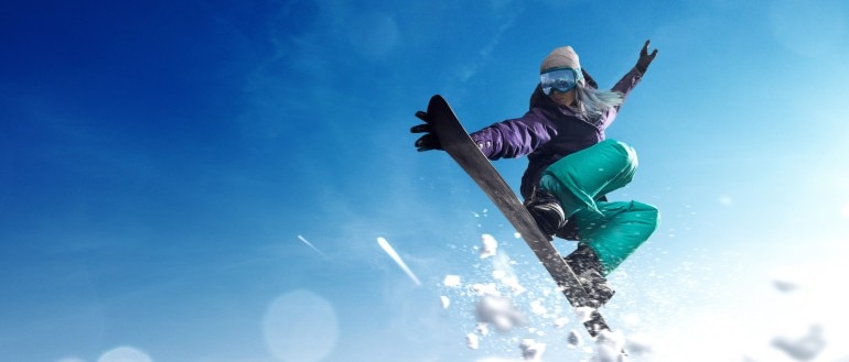 Snowboarder doing a trick in the air